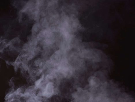 Photo of steam in front of a black background